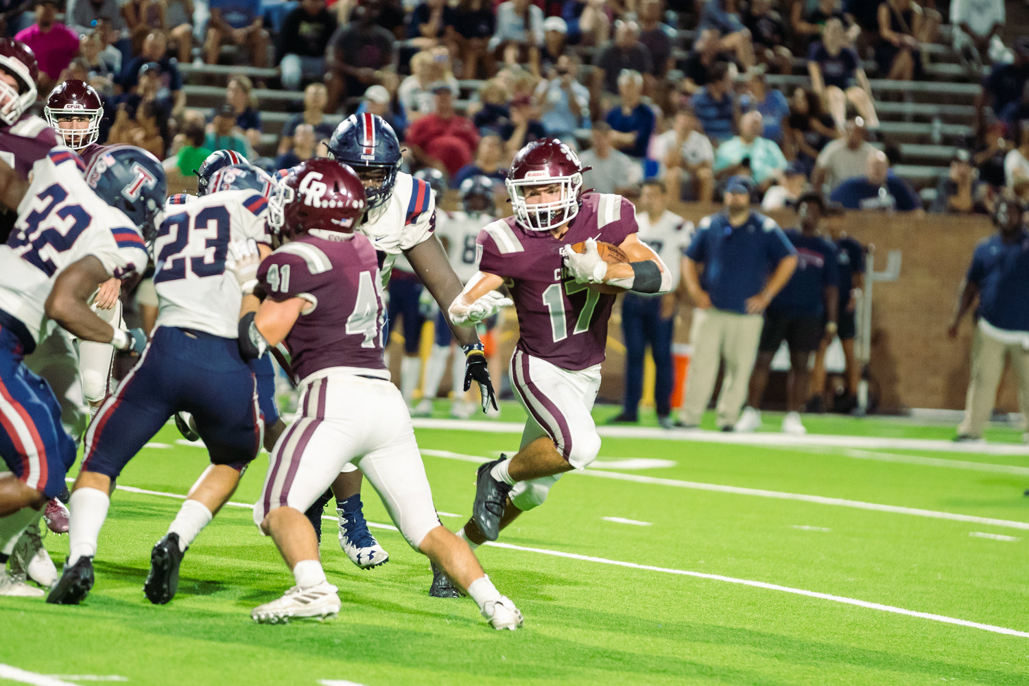 Cinco Ranch’s Eric Eckstrom breaks outside for extra yardage Cinco Ranch’s during Friday’s game between Cinco Ranch and Tompkins at Rhodes Stadium.